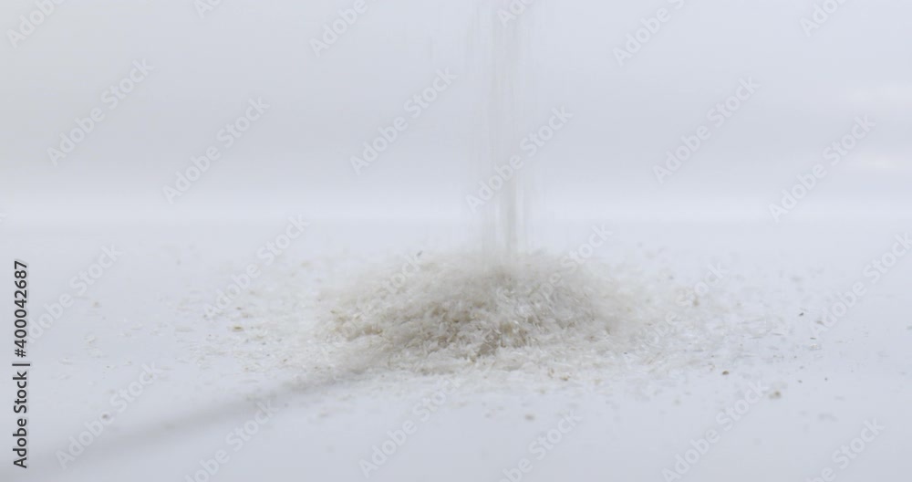 Psyllium Husks falling in Slow Motion. Isolated on white. A traditional remedy for diarrhea