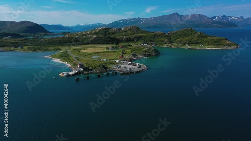 Aerial drone view of ferry dock and a queue row of cars waiting in Troms Norway photo