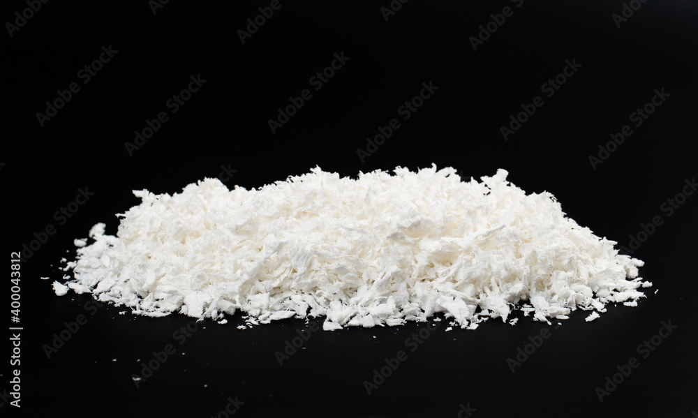 white artificial synthetic snow on black background white artificial synthetic snow on black background