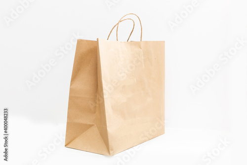 brown clear empty blank craft paper bag for takeaway isolated on white background. Packaging template mock up. Delivery service concept. Copy space.