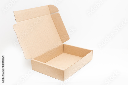empty open cardboard box on surface with empty space © Angelov
