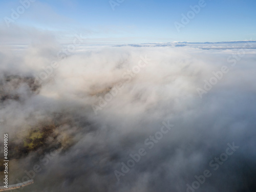 Fototapeta Naklejka Na Ścianę i Meble -  Aerial view of Viskyar Mountain covered with low clouds, Bulgaria