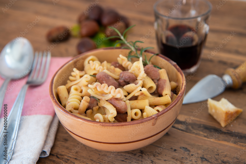 pasta and beans in a bowl on a wooden background, typical dish of Italian food pasta and beans in a bowl on a wooden background, typical dish of Italian food
