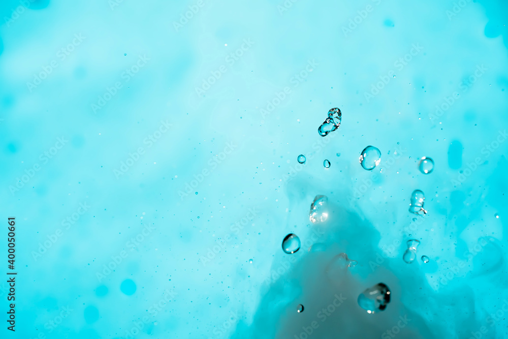 Water drop. Chemical reaction with boiling swirling water splashes, jumping drops with a large release of heat and gas vapor. Water splashing is a physical phenomenon Water drop. Chemical reaction with boiling swirling water splashes, jumping drops with a large release of heat and gas vapor. Water splashing is a physical phenomenon