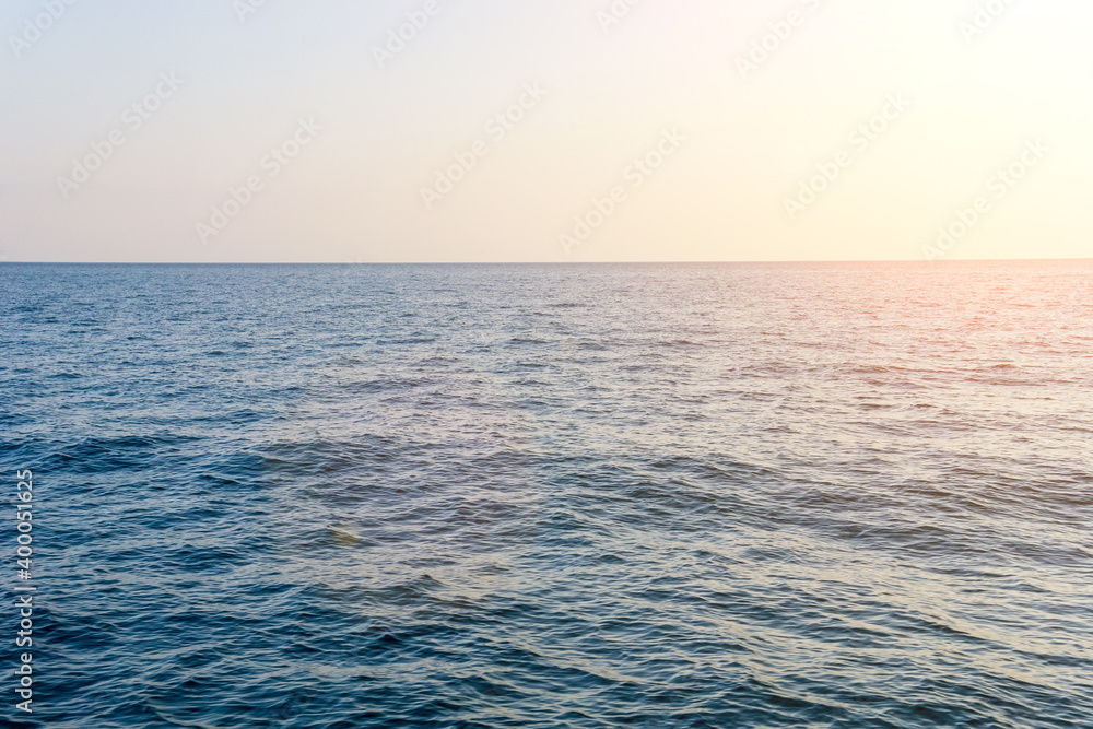 Panoramic sunset view over the sea. Nothing but sky and water. space for text