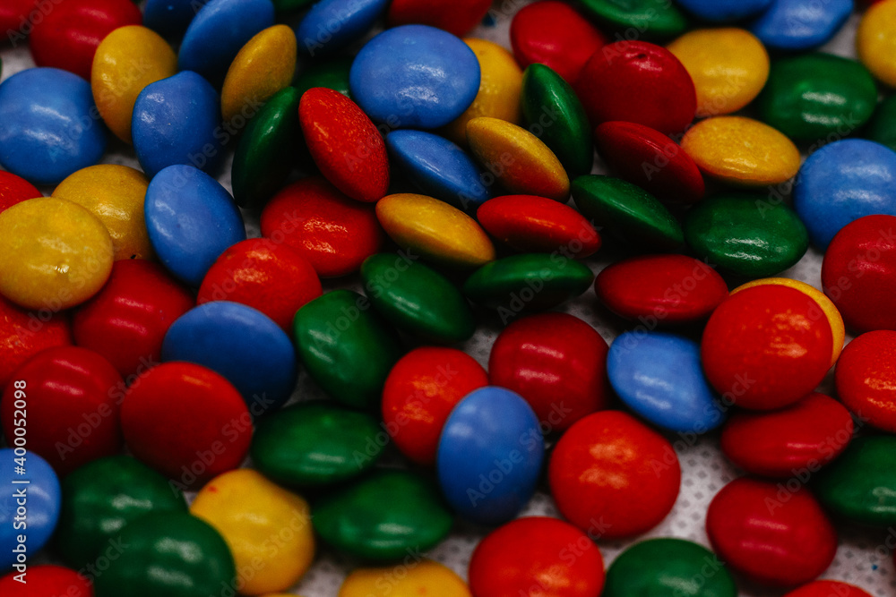 background of small round multicolored sweets close-up background of small round multicolored sweets close-up