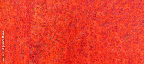 red rusty Metal texture with scratches and cracks which can be used as a background. banner
