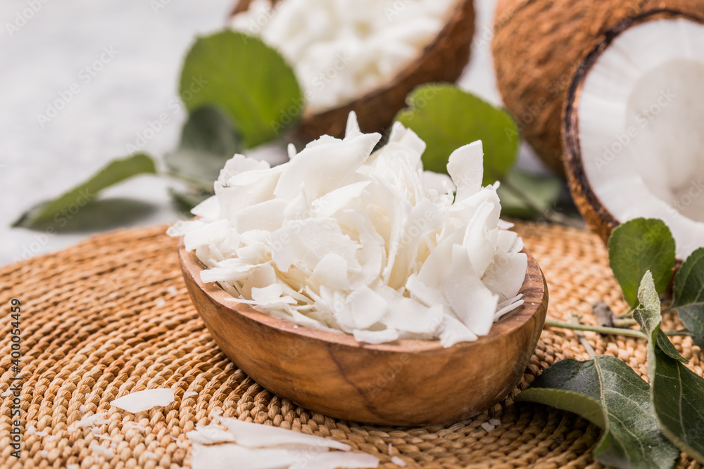 Whole and broken coconut with grated coconut flakes or chips. Whole and broken coconut with grated coconut flakes or chips.