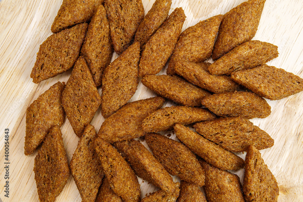 Croutons brown background, texture from pieces of dried bread. Top view Croutons brown background, texture from pieces of dried bread. Top view