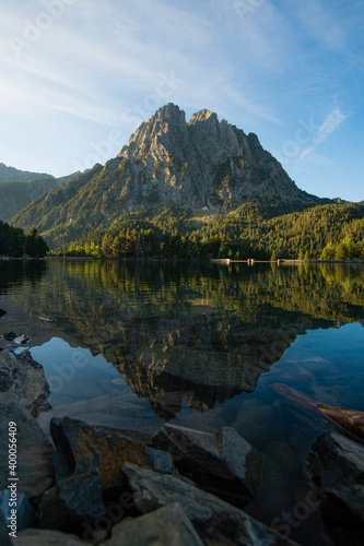 Vertical shot of the amazing landscpaes and a criytally clear water under the blue sky photo