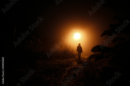 Girl at night in the fog.