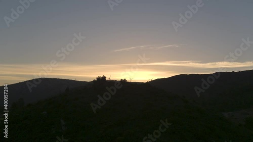 Wallpaper Mural Drone shot flying through the Black mountain of Narbonne during the sunrise with a beautiful light with big windmill farm around Torontodigital.ca