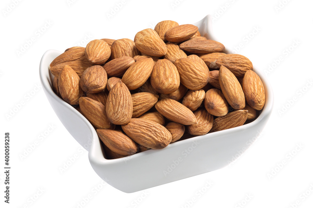 Raw almonds in a white plate isolated on white Raw almonds in a white plate isolated on white