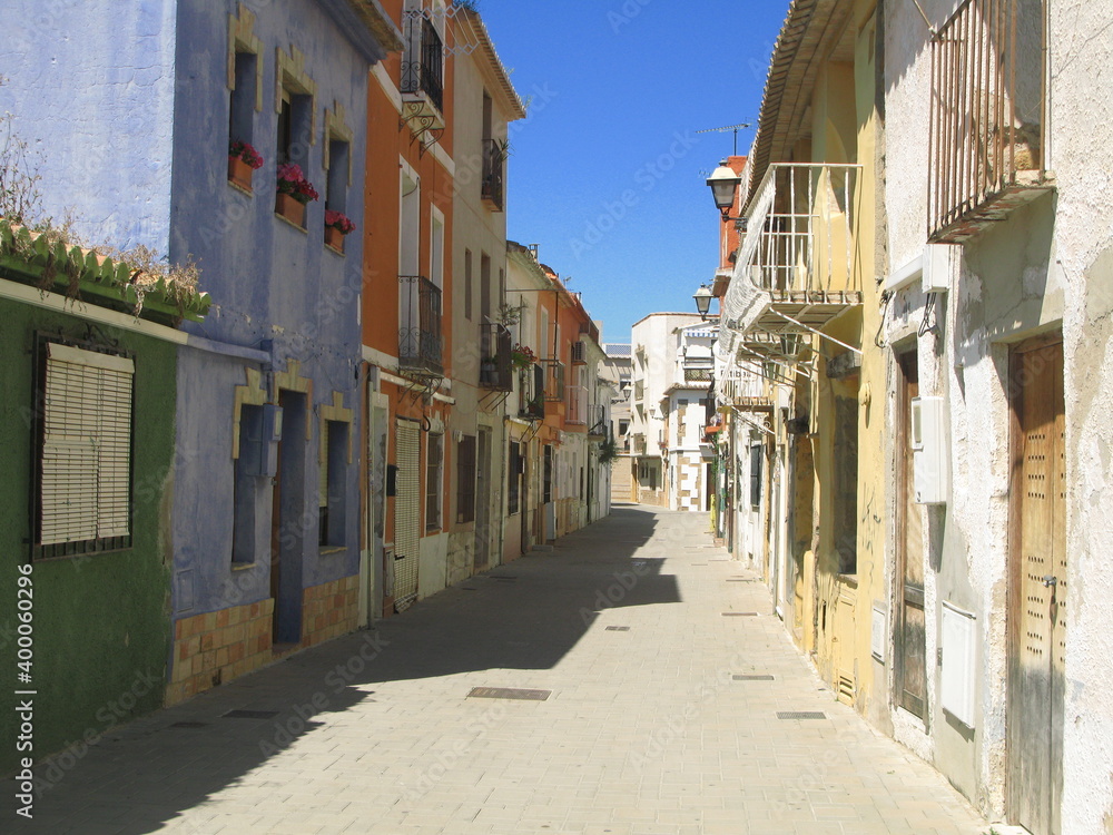 Empty street with colorful houses, Denia, Spain