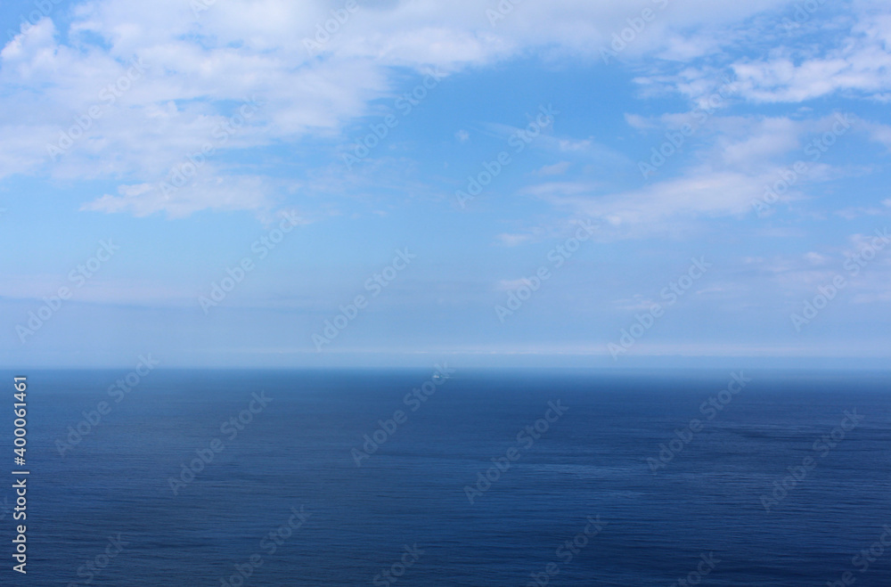 Colorful landscape with endless sea and beautiful clouds in the blue sky Colorful landscape with endless sea and beautiful clouds in the blue sky