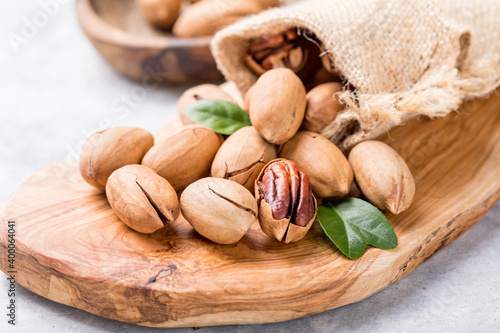 Pecan nut in a shell. Pecans are rich in various trace elements and vitamins. A nut in a shell. Pecans are rich in various trace elements and vitamins