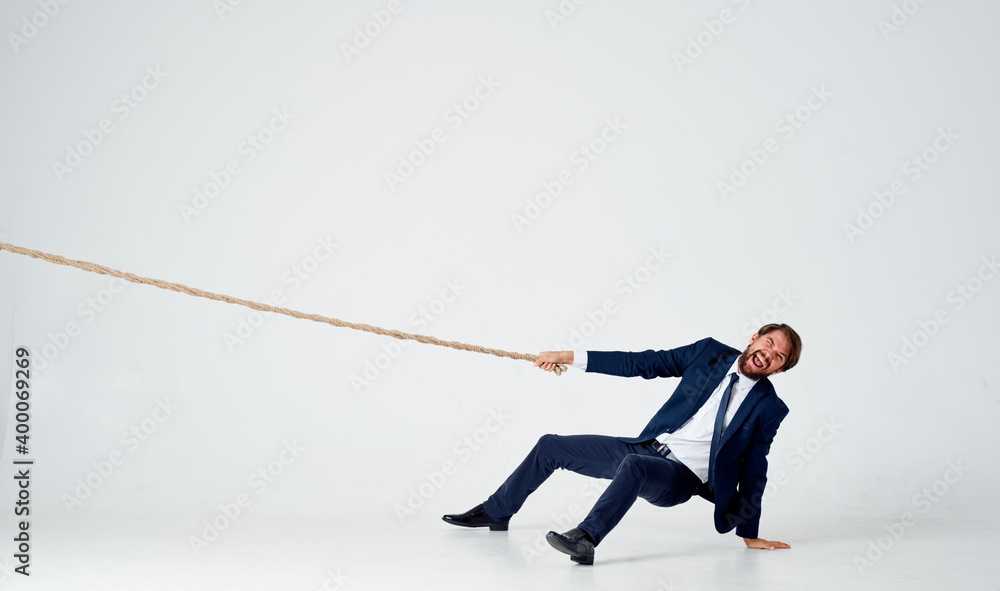 man with rope in hand on light background business finance man with rope in hand on light background business finance