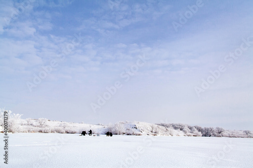winter lake view with snow. frozen lake with winter snow. winter wonderland © shevtsovy
