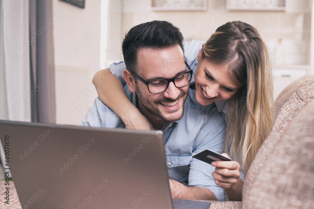Young couple shopping online at home Young couple shopping online at home