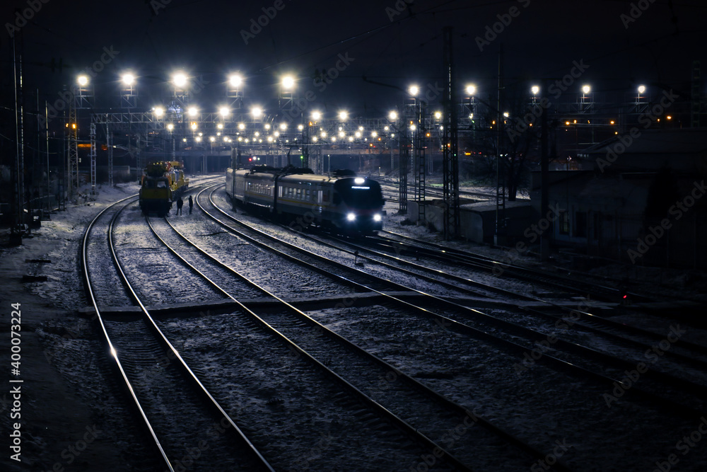 railway station with trains at night in blue tone railway station with trains at night in blue tone