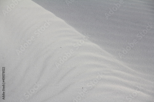 ripples and waves in white sand texture