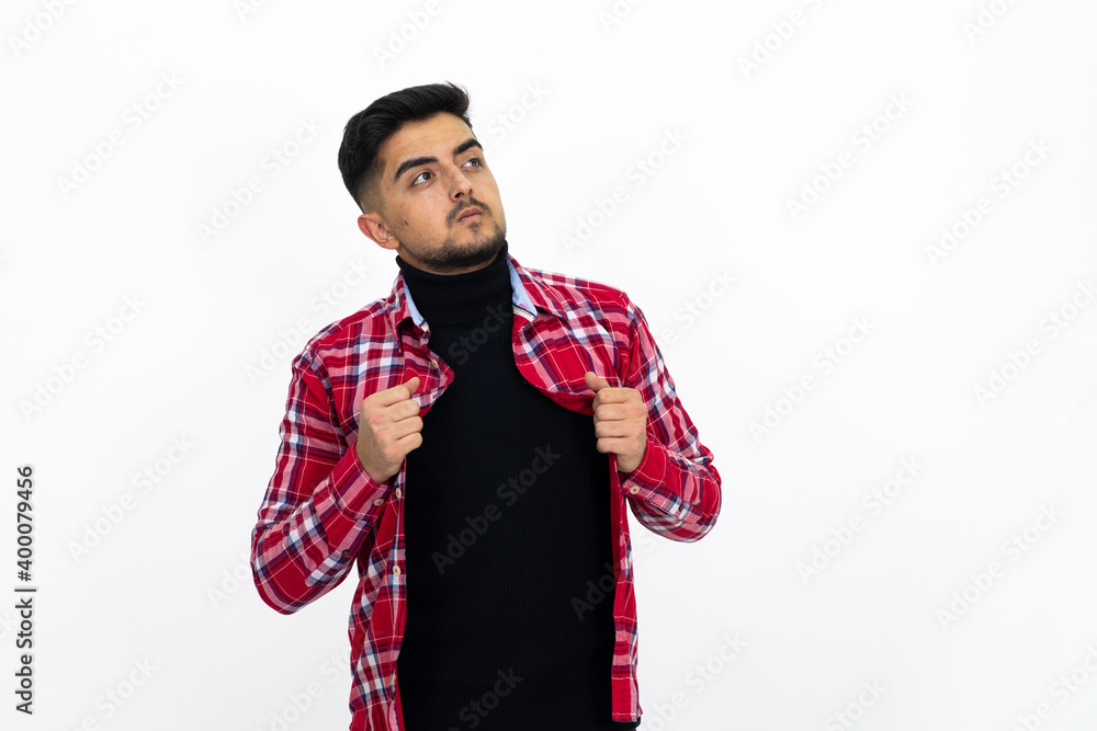 Handsome young man male model. Wearing a red checkered shirt. Handsome young man male model. Wearing a red checkered shirt.