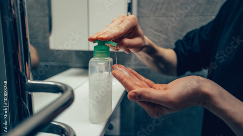 close up. man using a bactericidal hand soap.