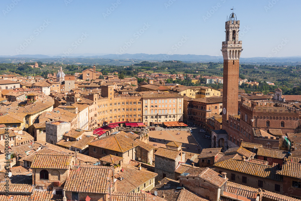 Top view of Piazza del Campo and the rooftops of Siena with detail of the bell tower