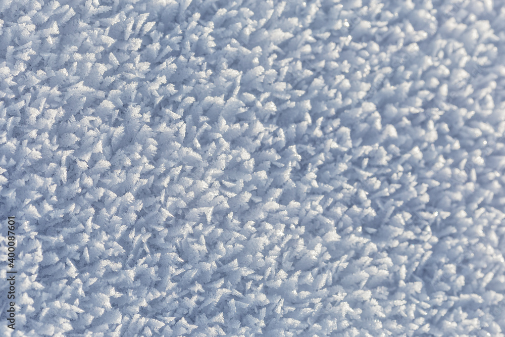 Winter, snow and frost, surface structure of a winter landscape with large crystals, white background. Winter, snow and frost, surface structure of a winter landscape with large crystals, white background.