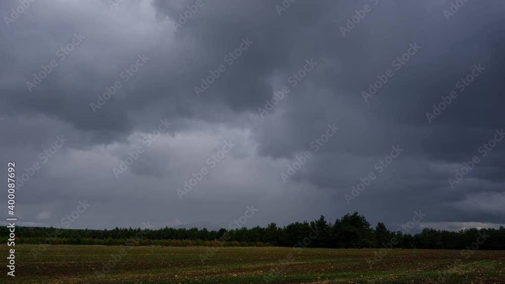 Time Lapse Vide of an Agricultural Field Beneath the Darkening and Lightening Cloudy Sky Time Lapse Vide of an Agricultural Field Beneath the Darkening and Lightening Cloudy Sky