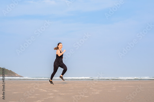 Woman running on the beach 