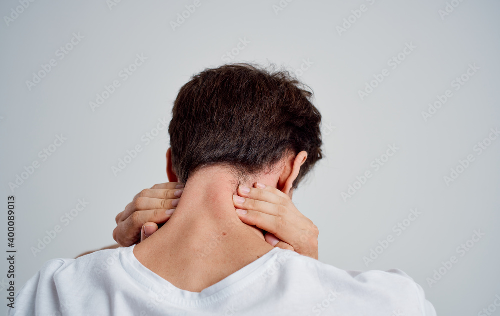 man touching his neck with his hand osteochondrosis back pain man touching his neck with his hand osteochondrosis back pain
