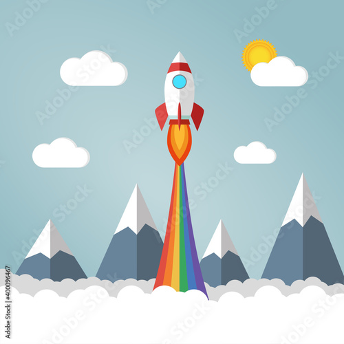 Rocket launches in the sky flying over mounts and white fluffy clouds and emits rainbow colored smoke. Copy space for design or text. Flat style design vector