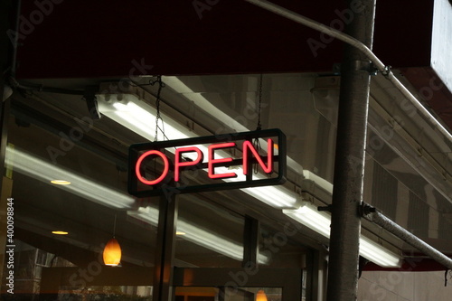 open sign in front of a store
