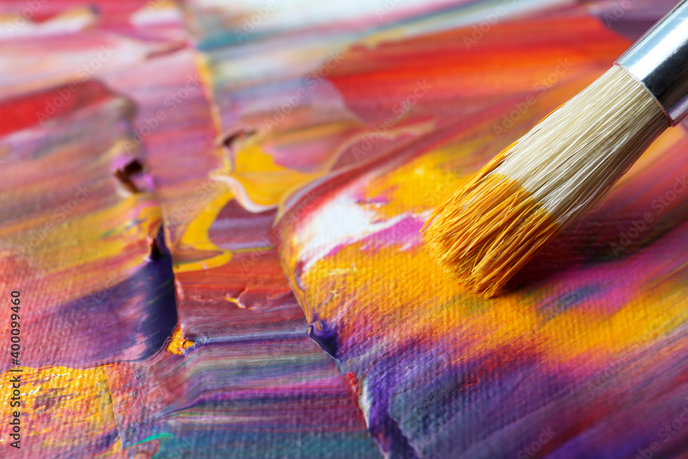 Fototapeta premium Abstract colorful paint and brush, closeup view