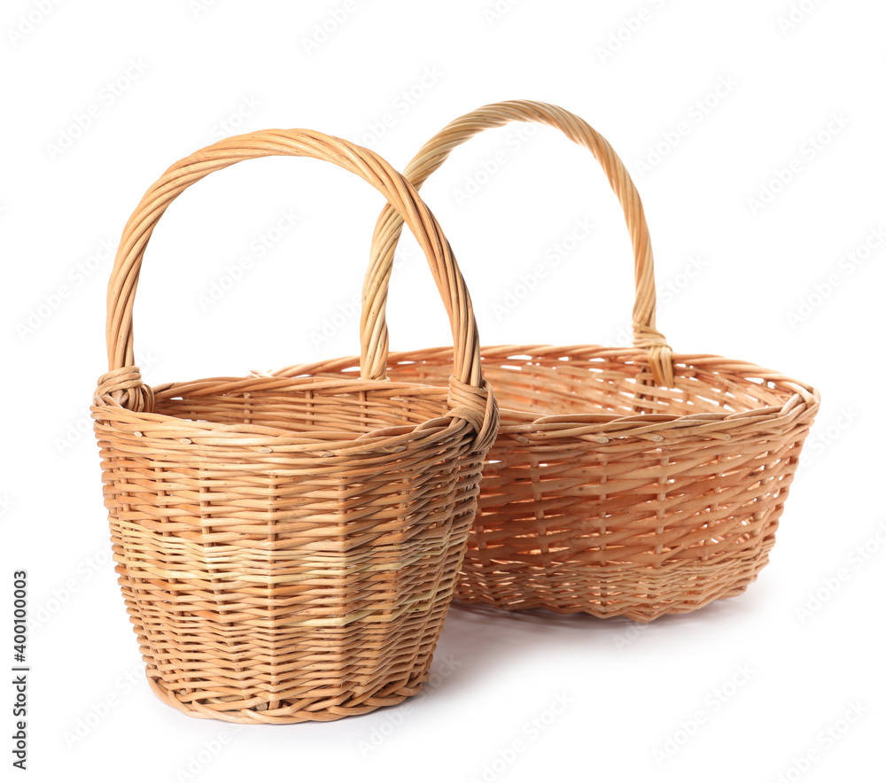 Two decorative wicker baskets on white background Two decorative wicker baskets on white background