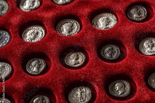 Numismatics.Authentic silver denarius, antoninianus of ancient Rome. A collector holds an old coin.Ancient coin of the Roman Empire photo