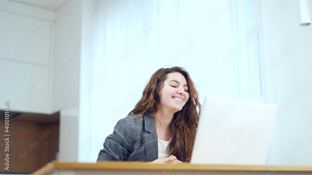 Euphoric lady gets new distance job opportunity, reads good news in email, rejoices victory, feels motivated. Excited young woman winner looks at laptop celebrates online success sits at table a home Euphoric lady gets new distance job opportunity, reads good news in email, rejoices victory, feels motivated. Excited young woman winner looks at laptop celebrates online success sits at table a home