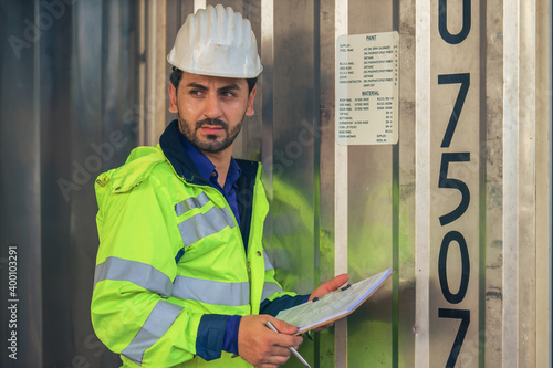 actory warehouse supervisor in front of tempurature control gate curtains photo