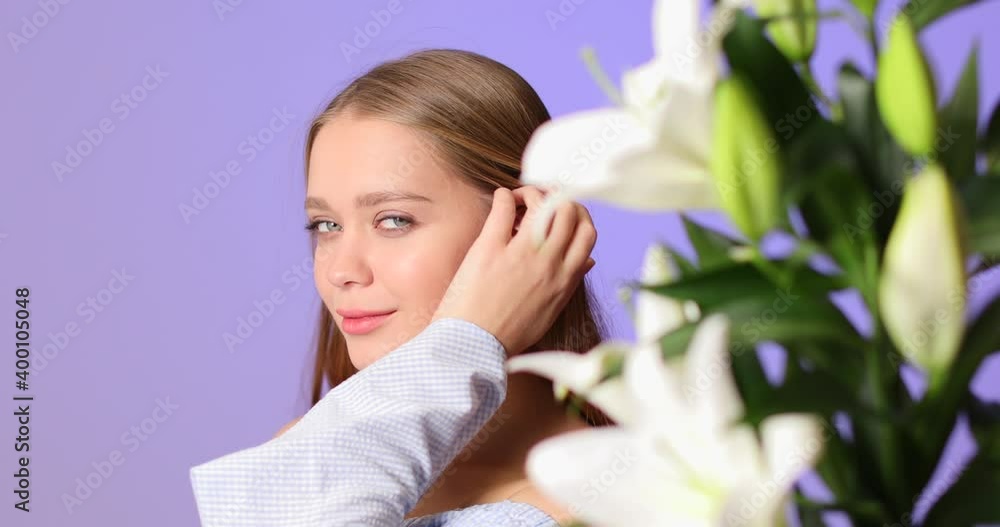 Bouquet of fresh lilies and beautiful young woman on color background Bouquet of fresh lilies and beautiful young woman on color background
