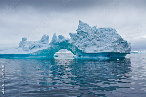 Iceberg arch in Disko Bay, Ilulissat, West Greenland © Michele Burgess