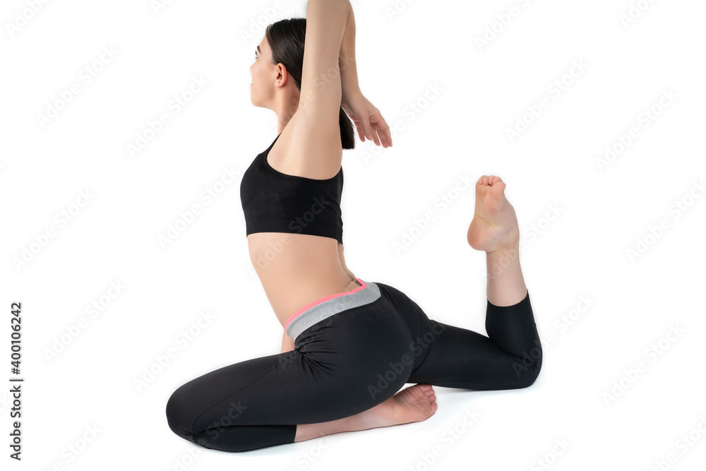 Young woman doing yoga practice isolated on white background. Flexible fit female body. Young woman doing yoga practice isolated on white background. Flexible fit female body.