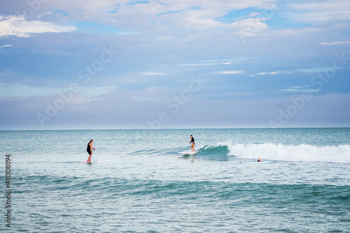 Surfing Along the Coastline in Mon Repos © Michael