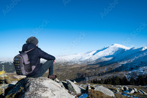 The young man enjoying the nature in mountains