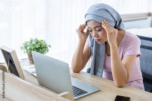 фотографія Stressed of a asian women disease mammary cancer patient Have a headaches stick