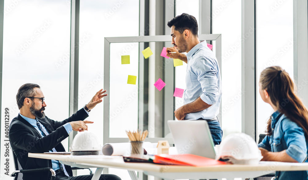Obraz premium Group of professional business meeting and discussing strategy with new startup project.Creative business people planning and brainstorm with document report in modern workloft.Teamwork concept