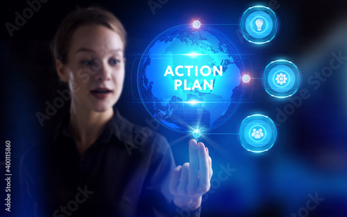 Business, Technology, Internet and network concept. Young businessman working on a virtual screen of the future and sees the inscription: Action plan
