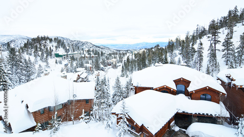 Snow covered houses in the mountains at Lake Tahoe Ski Resort area in the Sierra Nevada range of California. 