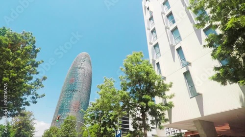 Driving Towards Agbar Tower (Torre Glories), Skyscraper In New Technological District Of Barcelona, Catalonia, Spain - low angle shot photo