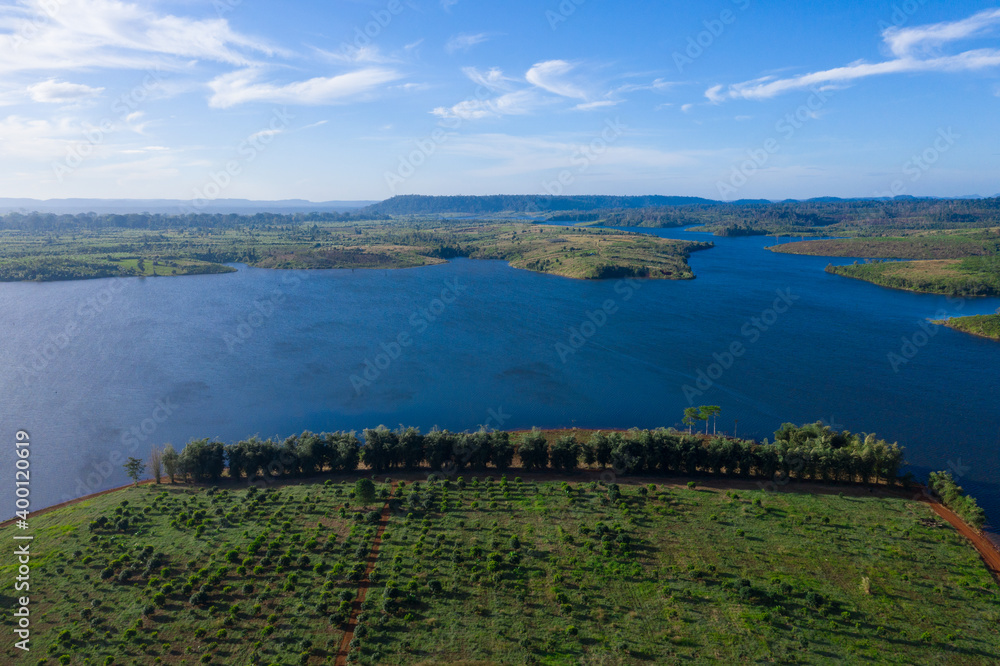 Beautiful lake nestled among rainforest in mountian at Veal Veng - Cambodia  under blue sky with white clouds. 